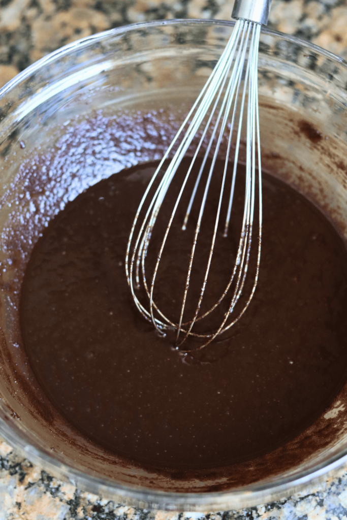 6. Carefully pour the browned butter into the large mixing bowl and whisk vigorously for 30 seconds.