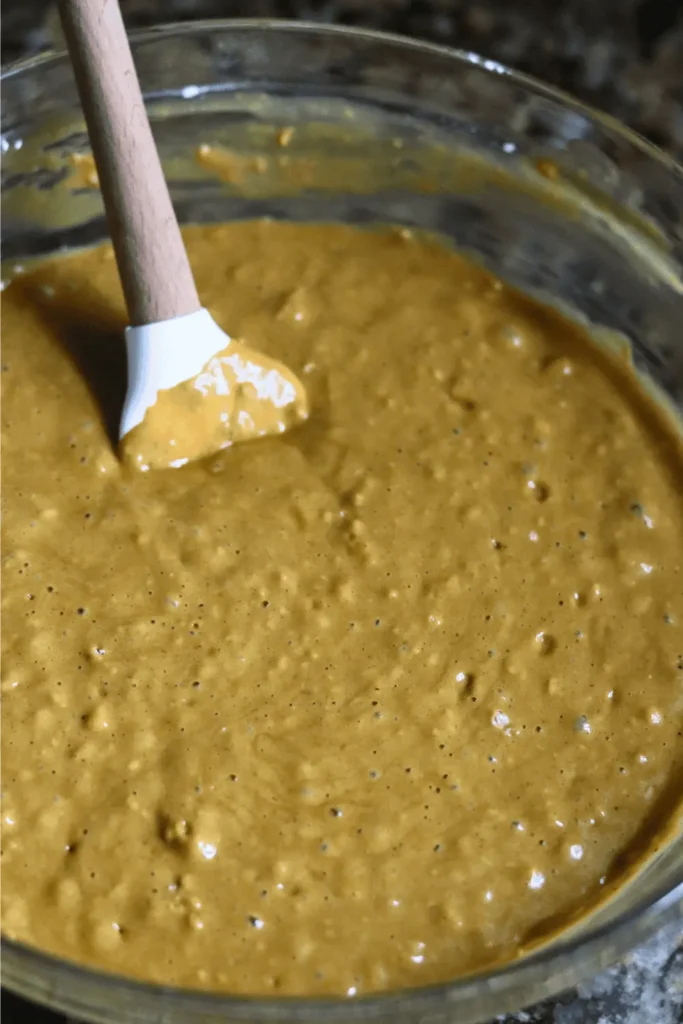 In a large mixing bowl, add the flour, baking powder, baking soda, ginger, cinnamon, cloves, nutmeg and salt. Whisk until thoroughly combined.